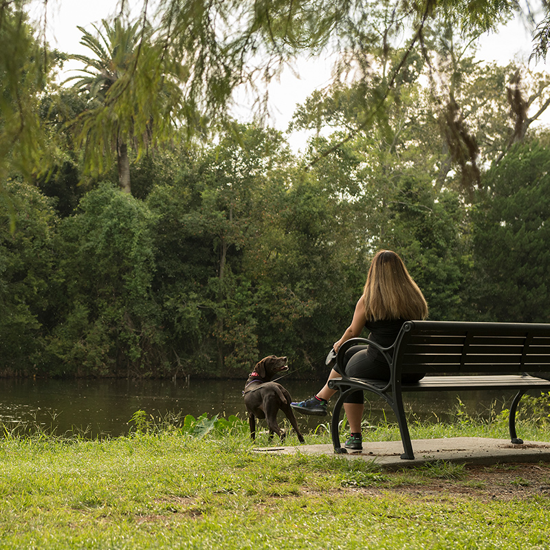 Girl sitting with dog in Audubon Park