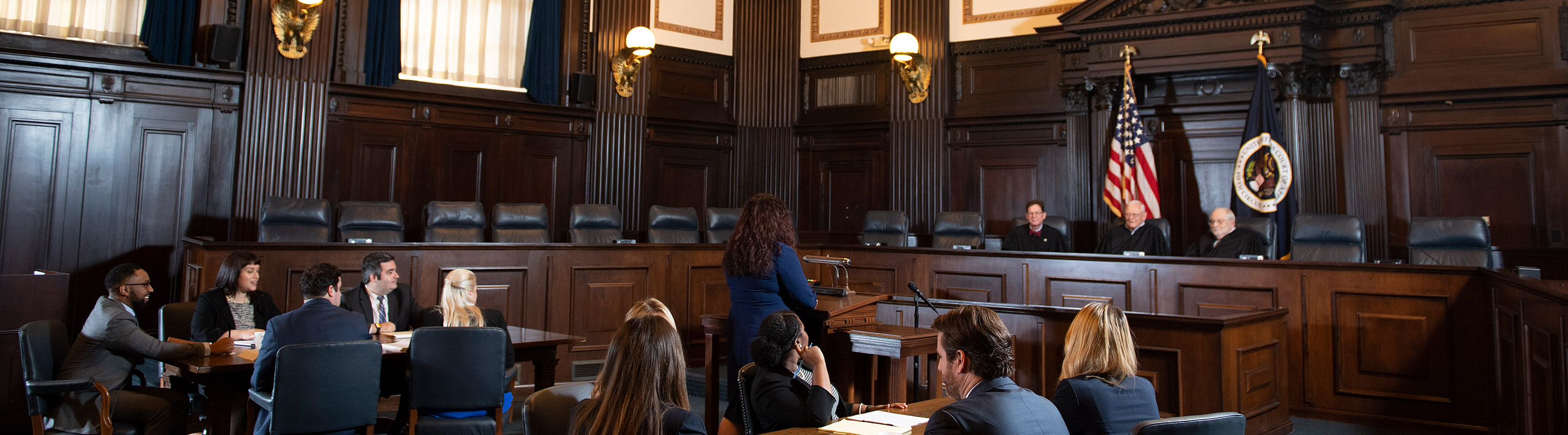 Students and judges in a courtroom