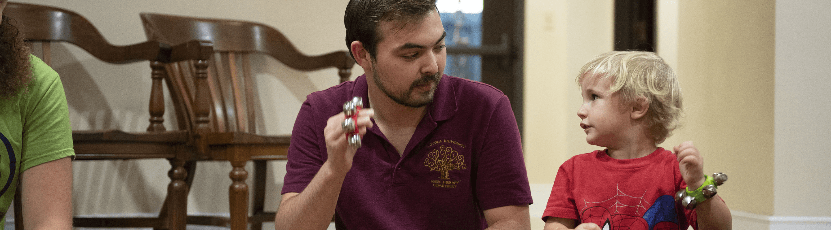 online master of music therapy student making music with a patient.