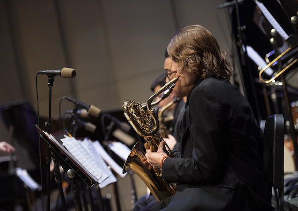 Baritone Saxophone player side profile