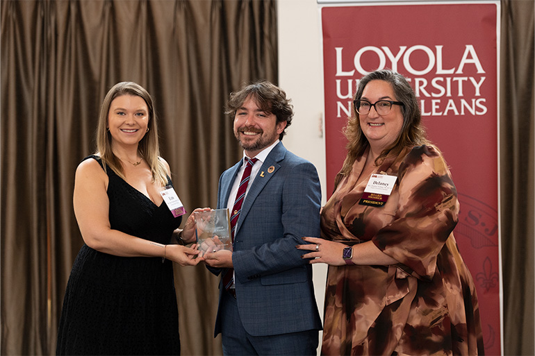 President of the Young Alumni Pack Board, Erin Schwarzbach '16, Young Alumnus of the Year Award recipient, G. Samuel “Sam” McCabe ‘14, and President of the Alumni Association Board, Delaney Vollmer ’04, J.D. ’19.