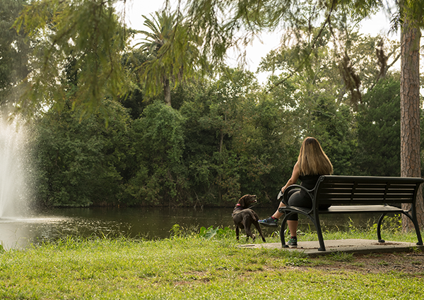 Girl and dog in Audubon Park