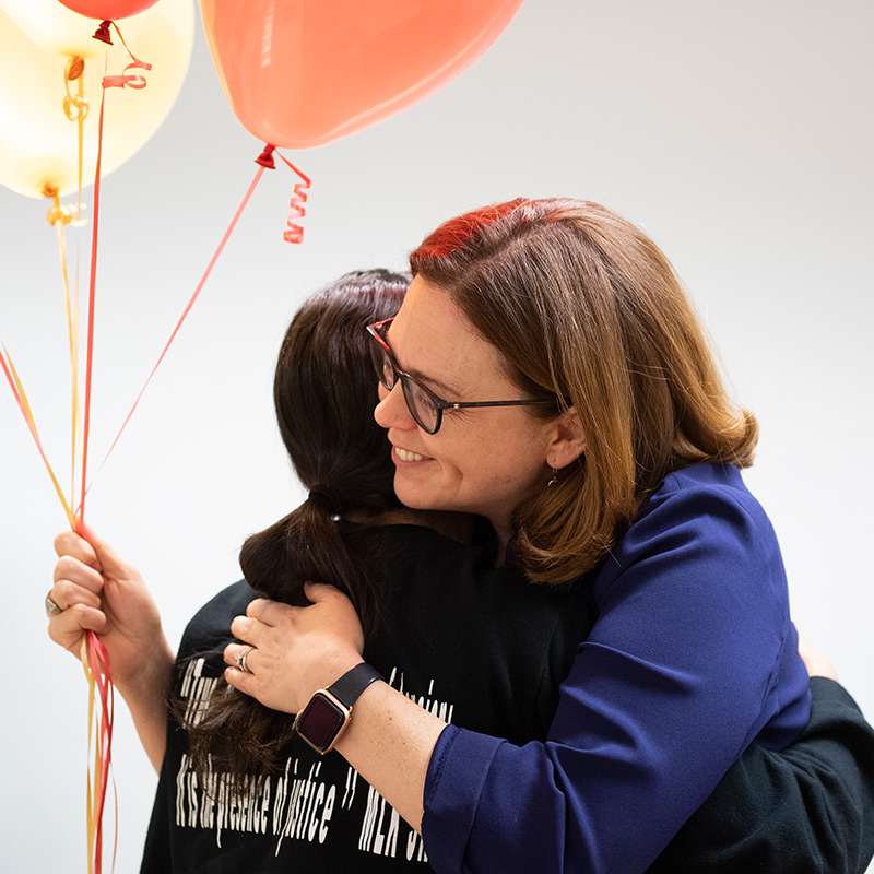 President Tetlow gives Rana Thabata a hug